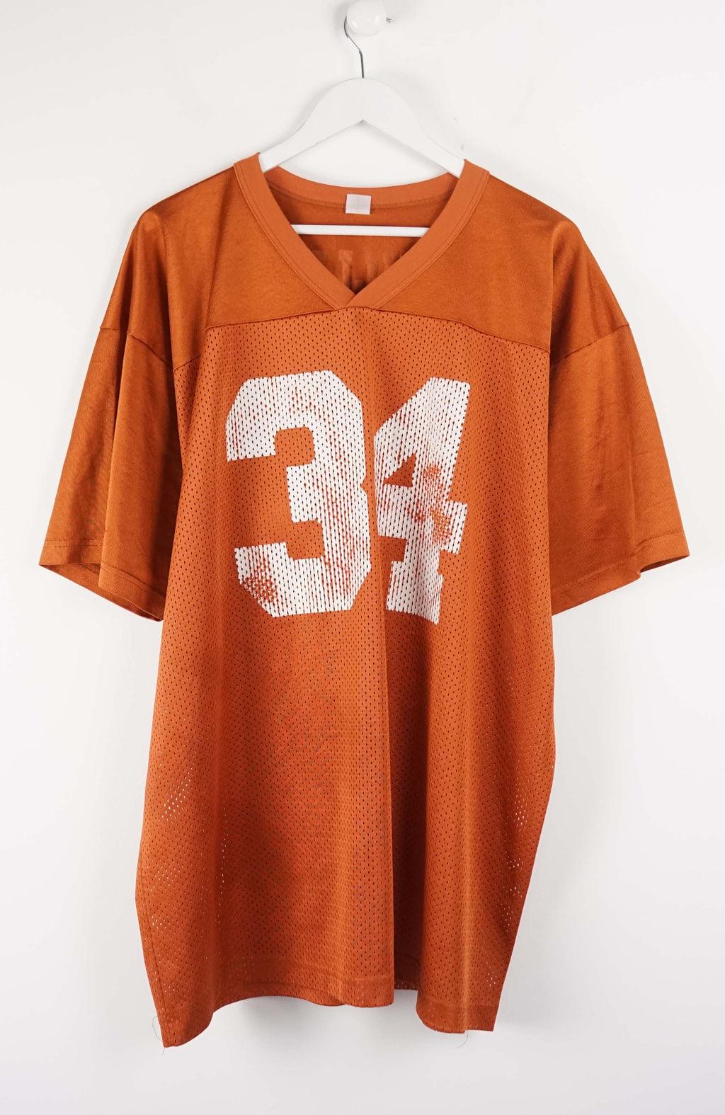 Orange sports jersey with number 34 on a white background