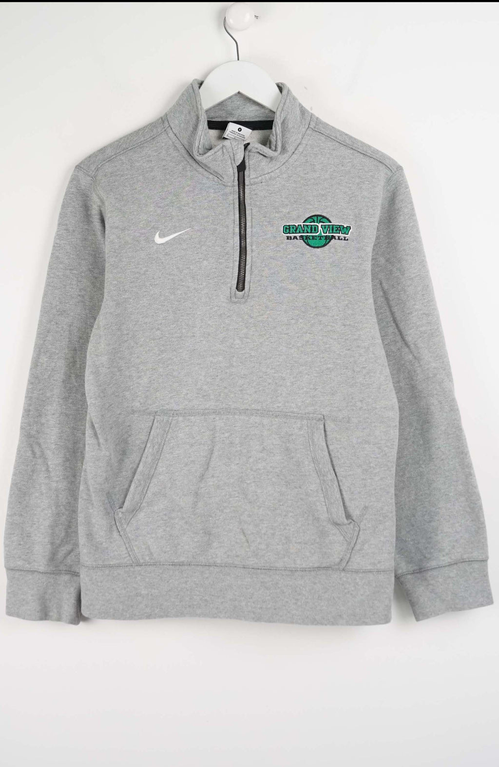 Gray Nike pullover with a logo on a white background