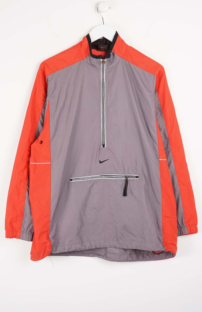 Gray and orange jacket with Nike logo on a white background