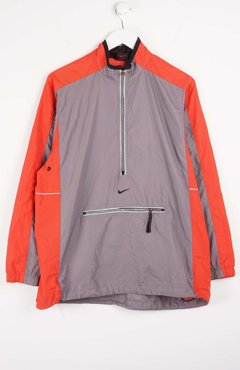 Gray and orange jacket with Nike logo on a white background