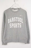 Gray sweatshirt with 'Barstool Sports' text and Nike logo on a white background