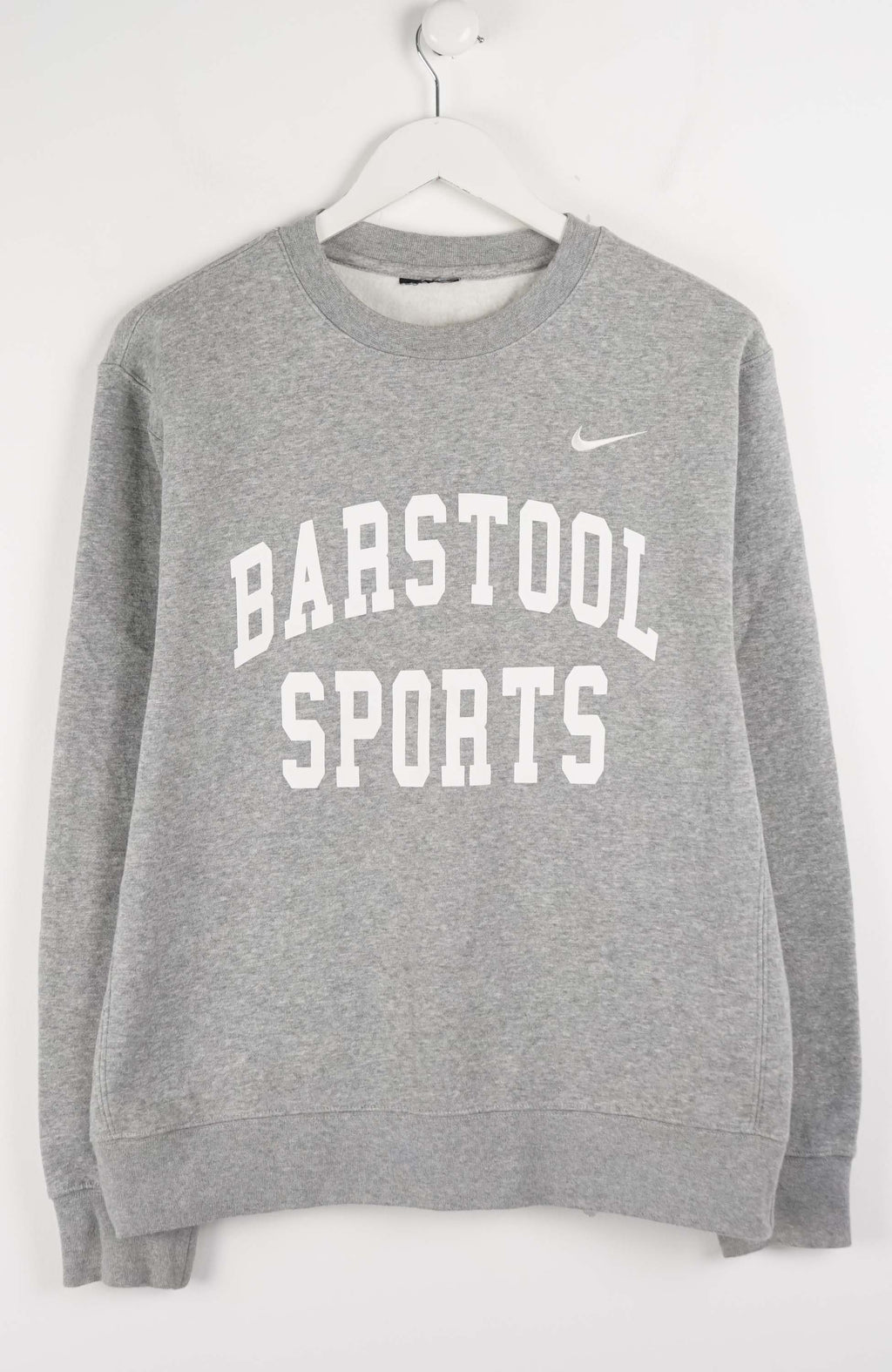 Gray sweatshirt with 'Barstool Sports' text and Nike logo on a white background