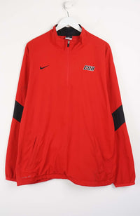 Red sports jacket with black sleeves and logos on a white background
