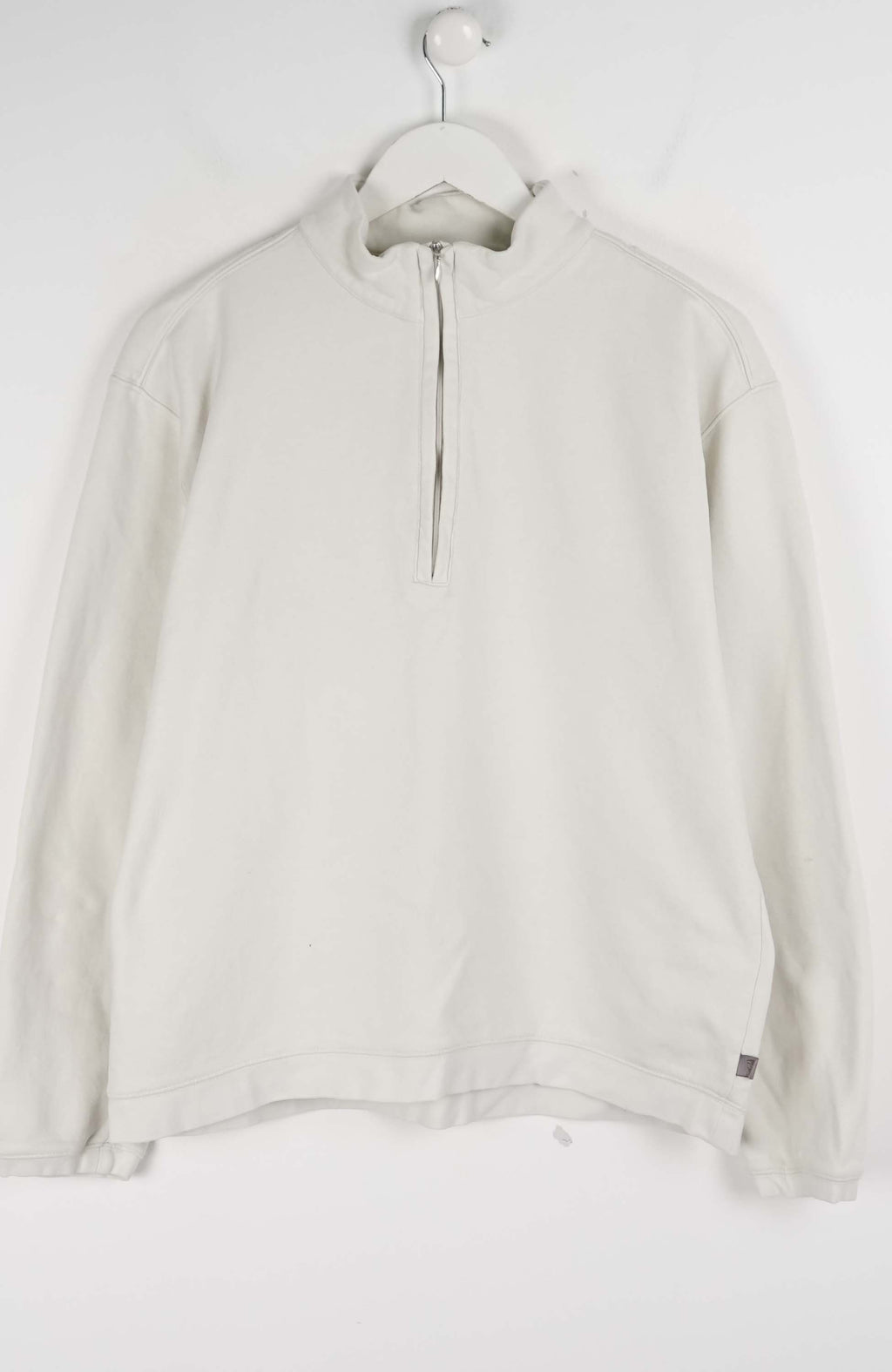 Light gray long-sleeve shirt on a hanger against a white background