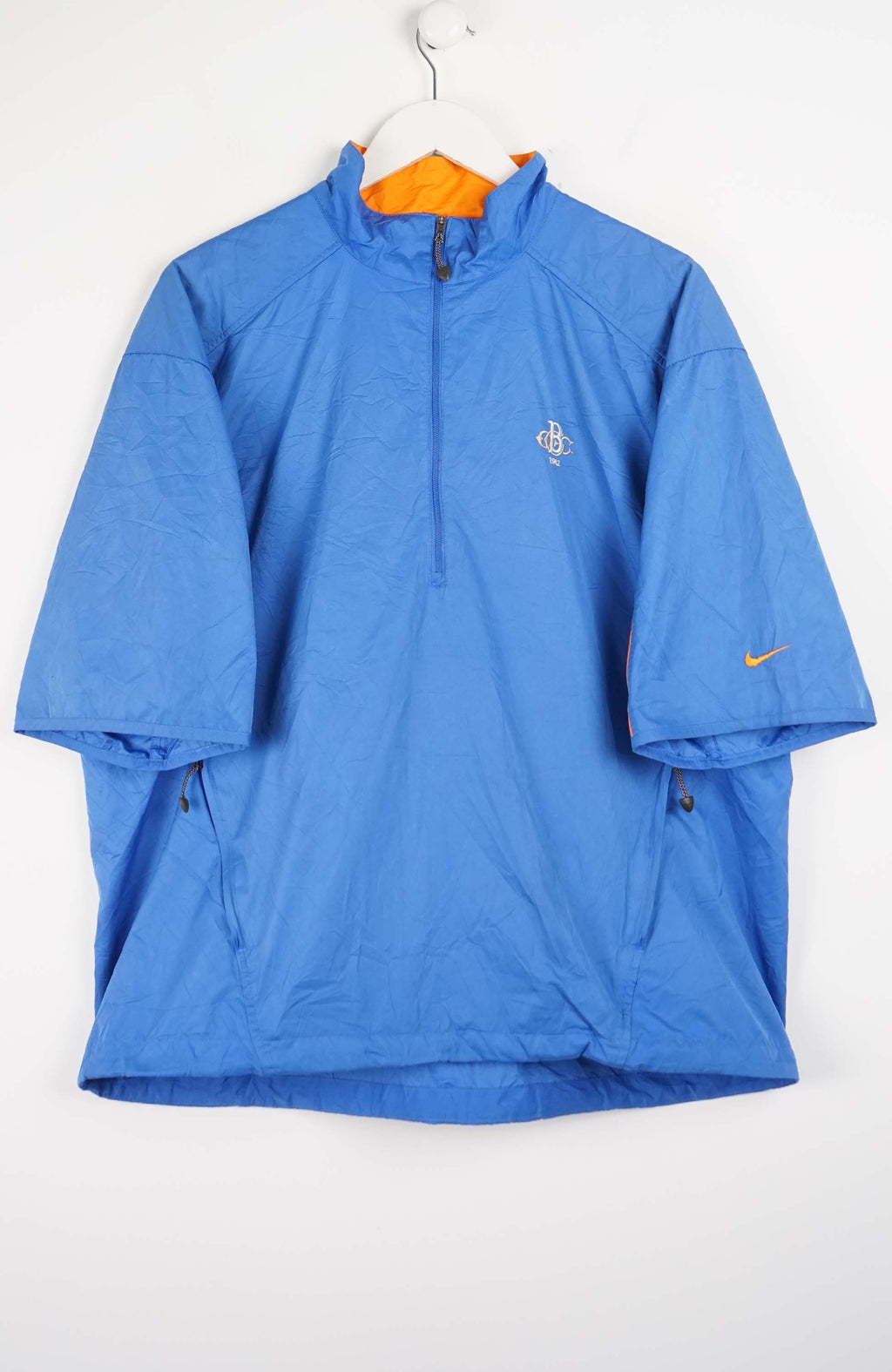 Blue jacket with Nike logo on a white background