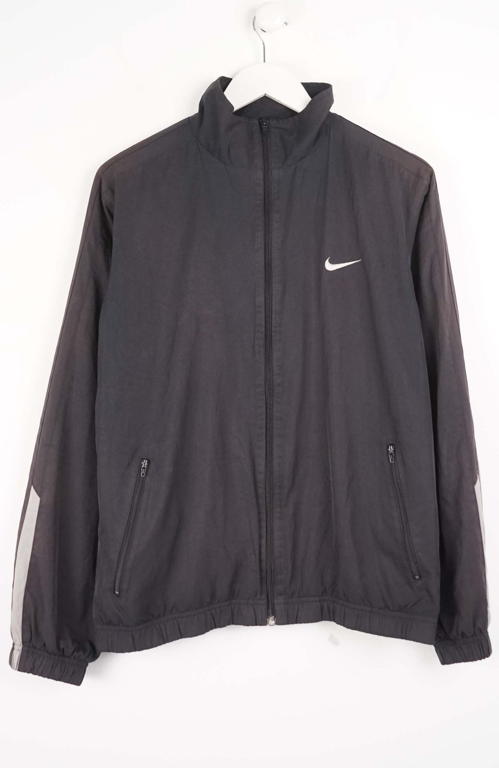 Black jacket with a Nike logo on a white background