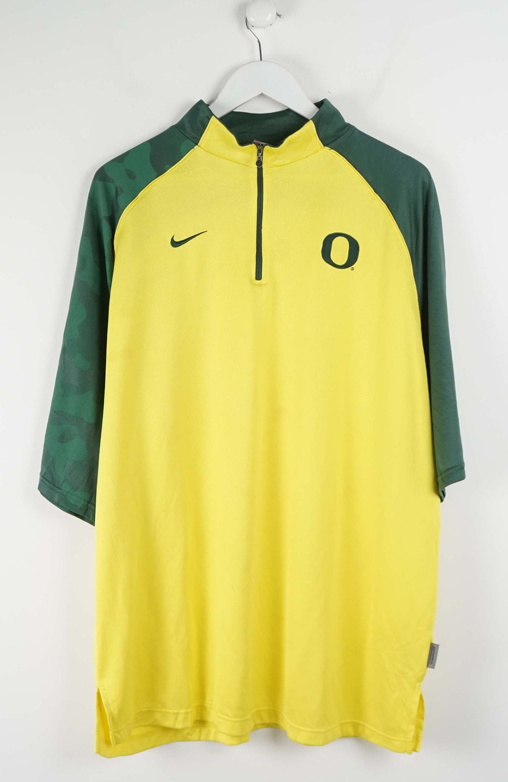 Yellow and green sports jersey with Nike logo on a white background