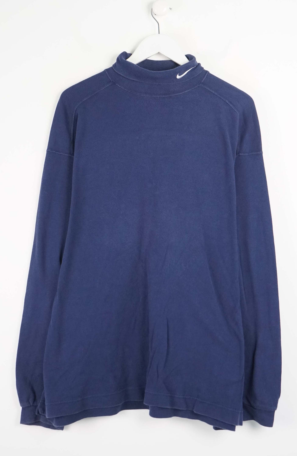 Blue sweatshirt on a white hanger against a white background