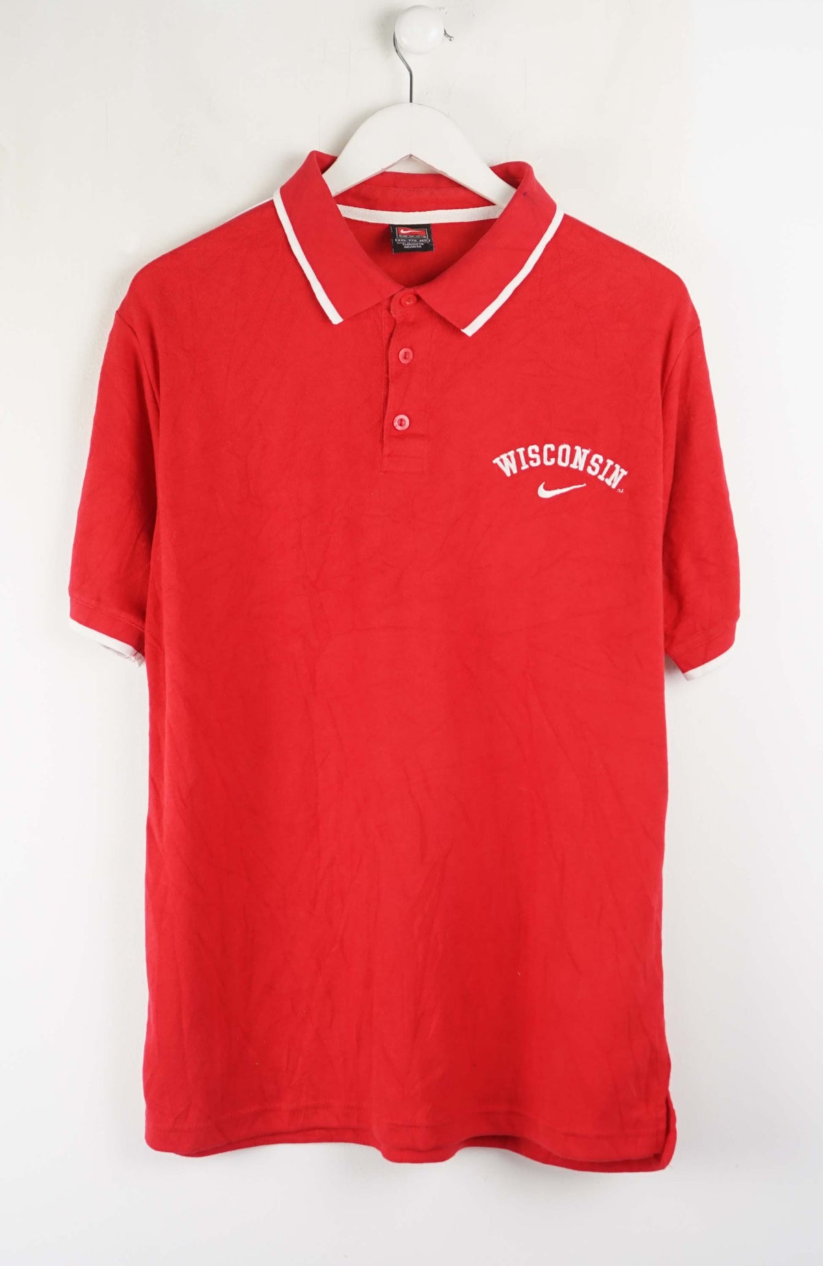 Red polo shirt with 'Wisconsin' text on a white background