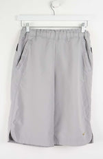 Gray shorts with a Nike logo on a white background