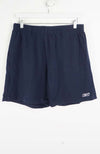 Navy blue shorts with a brand logo on a white background