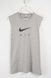 Gray sleeveless Nike shirt with black logo on a white background