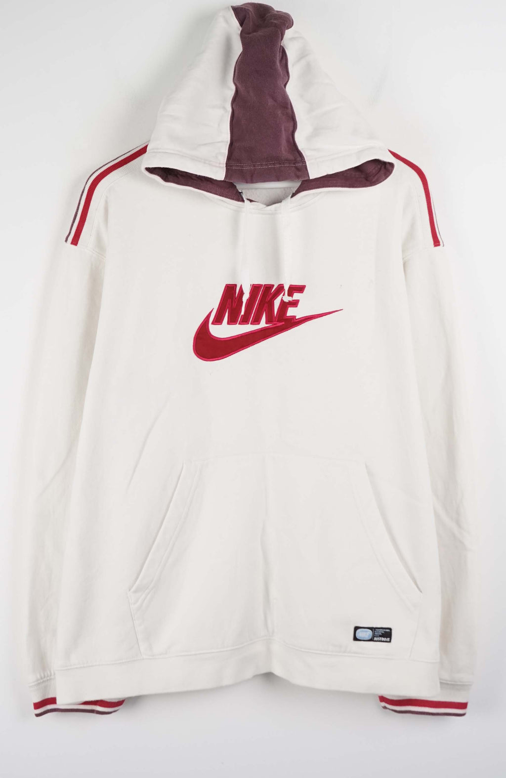 White hoodie with red Nike logo on a white background