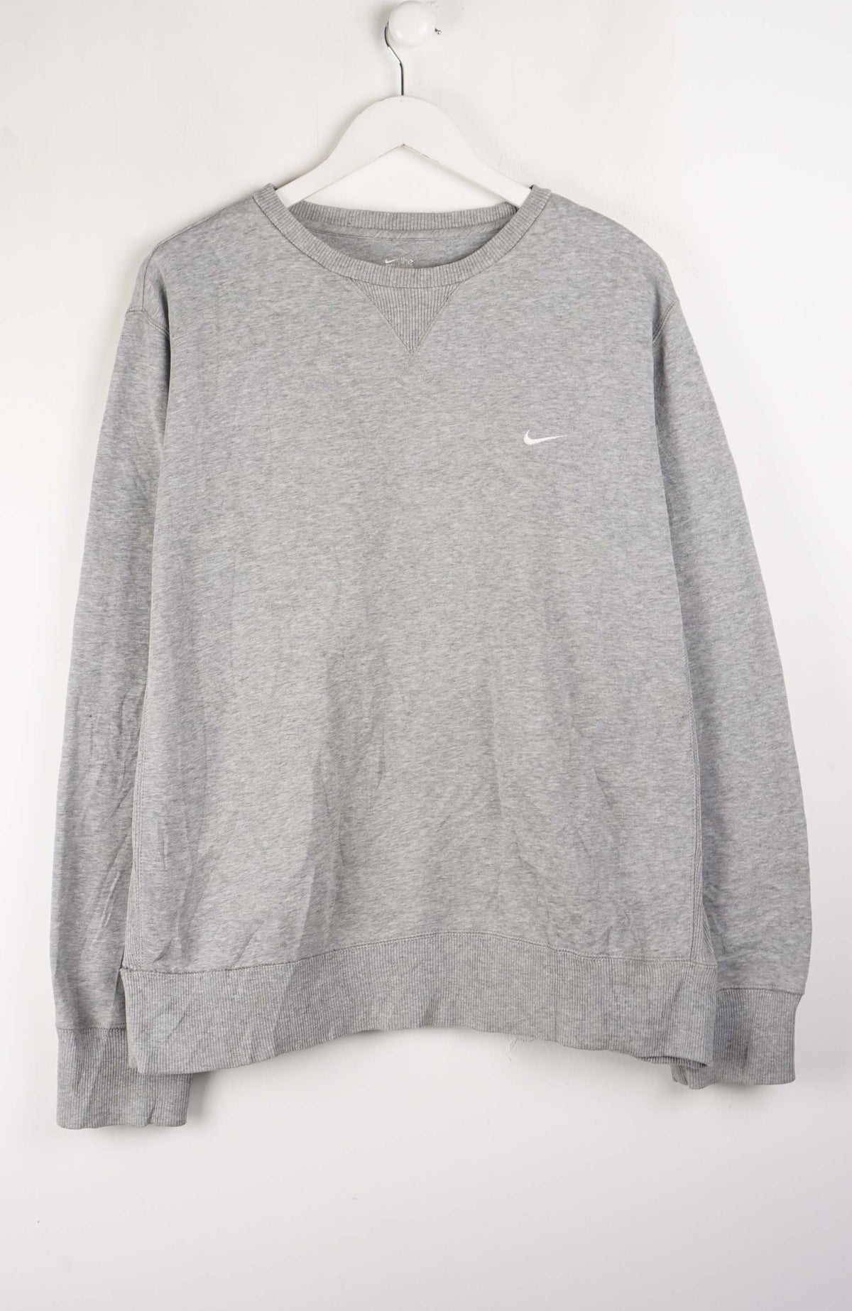 Gray sweatshirt with a small logo on a white hanger
