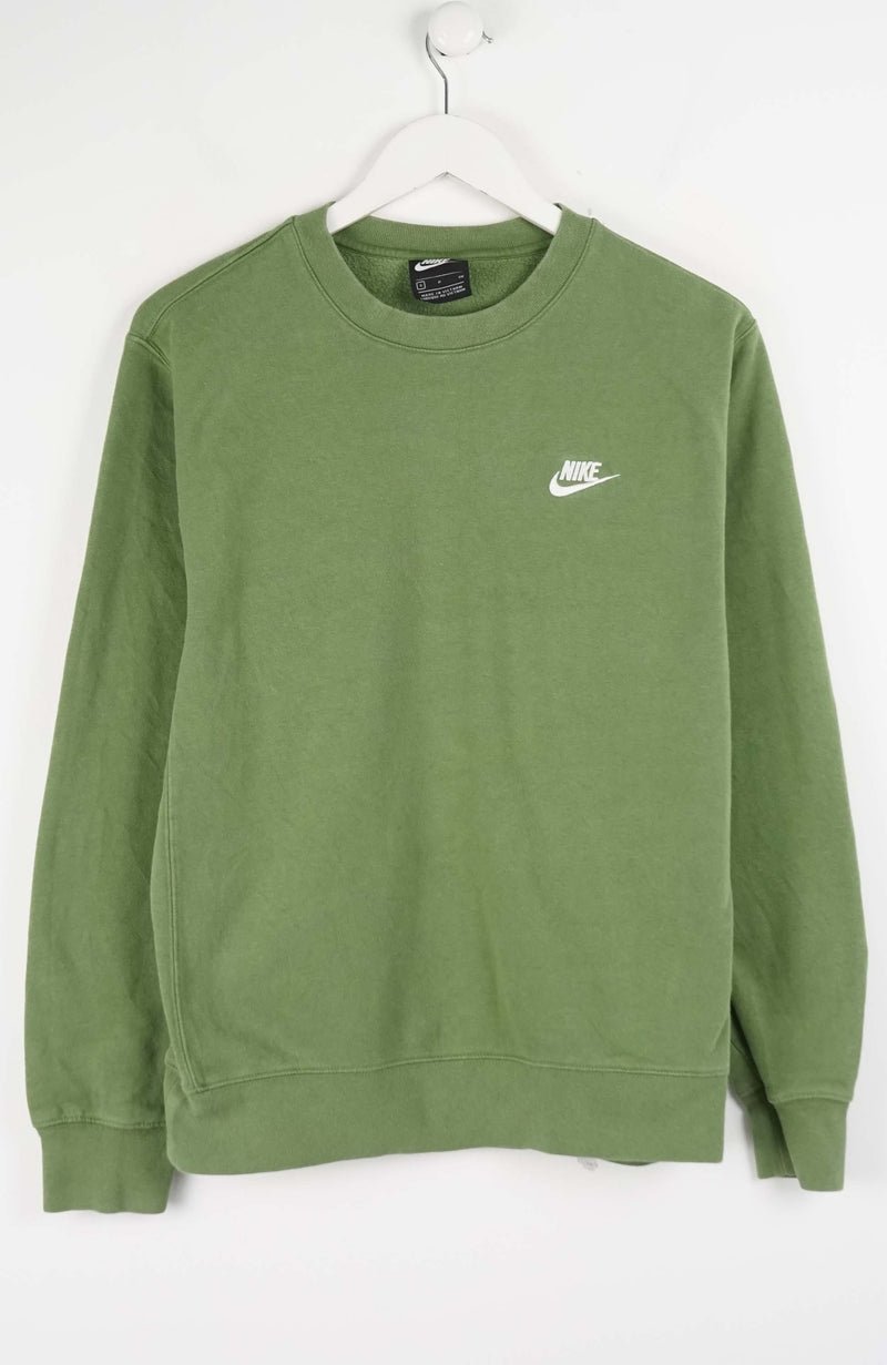 Green Nike sweatshirt on a white hanger against a white background