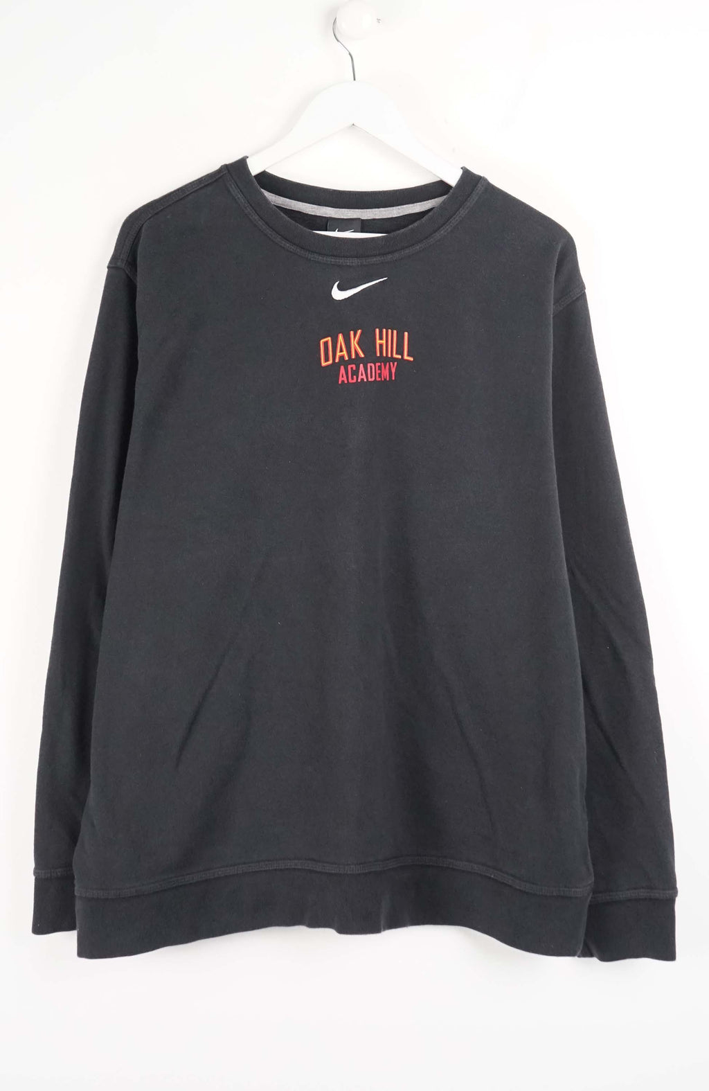 Black sweatshirt with 'Oak Hill Academy' text and Nike logo on a white background