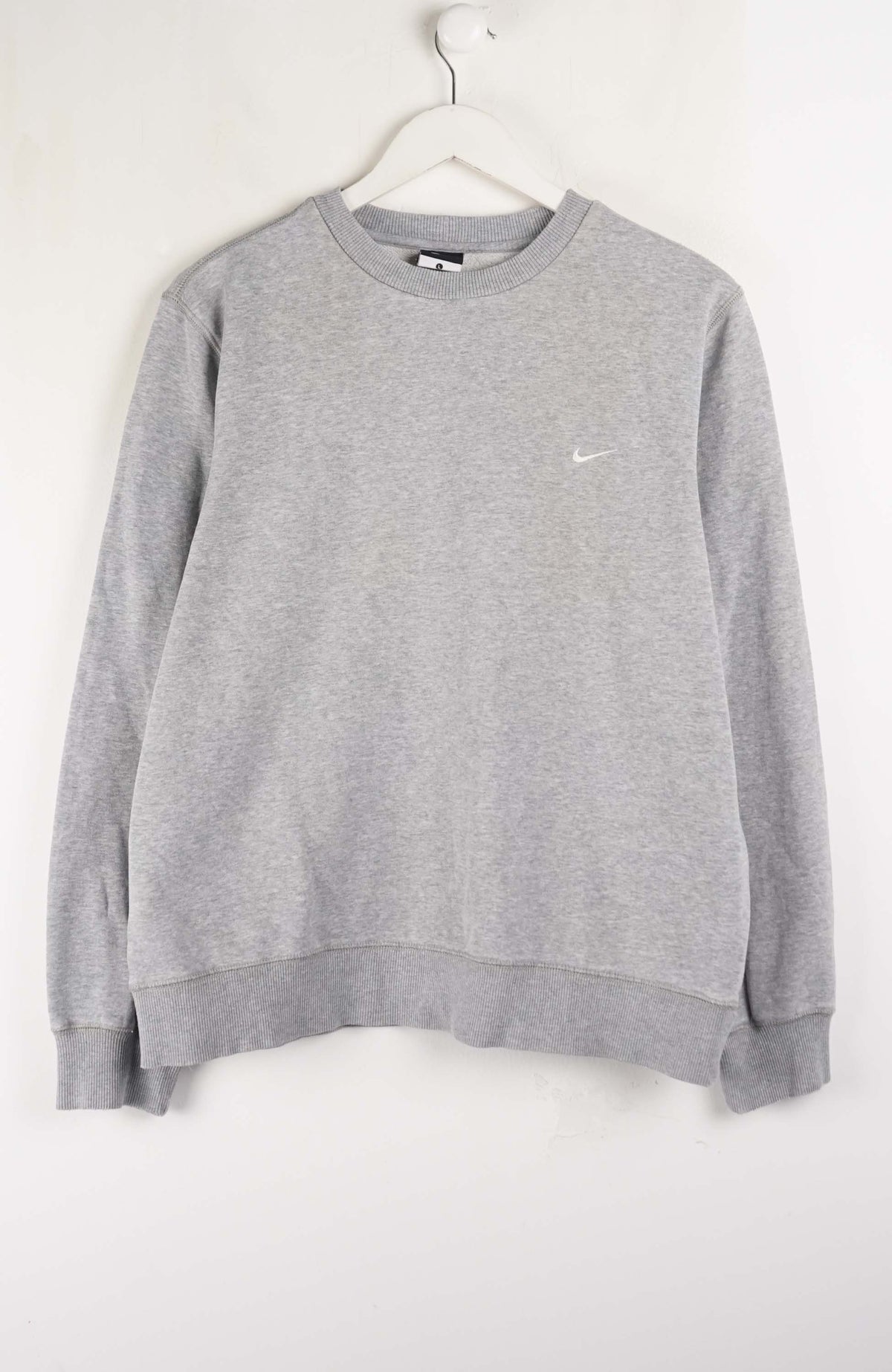 Gray sweatshirt with a small logo on a white background