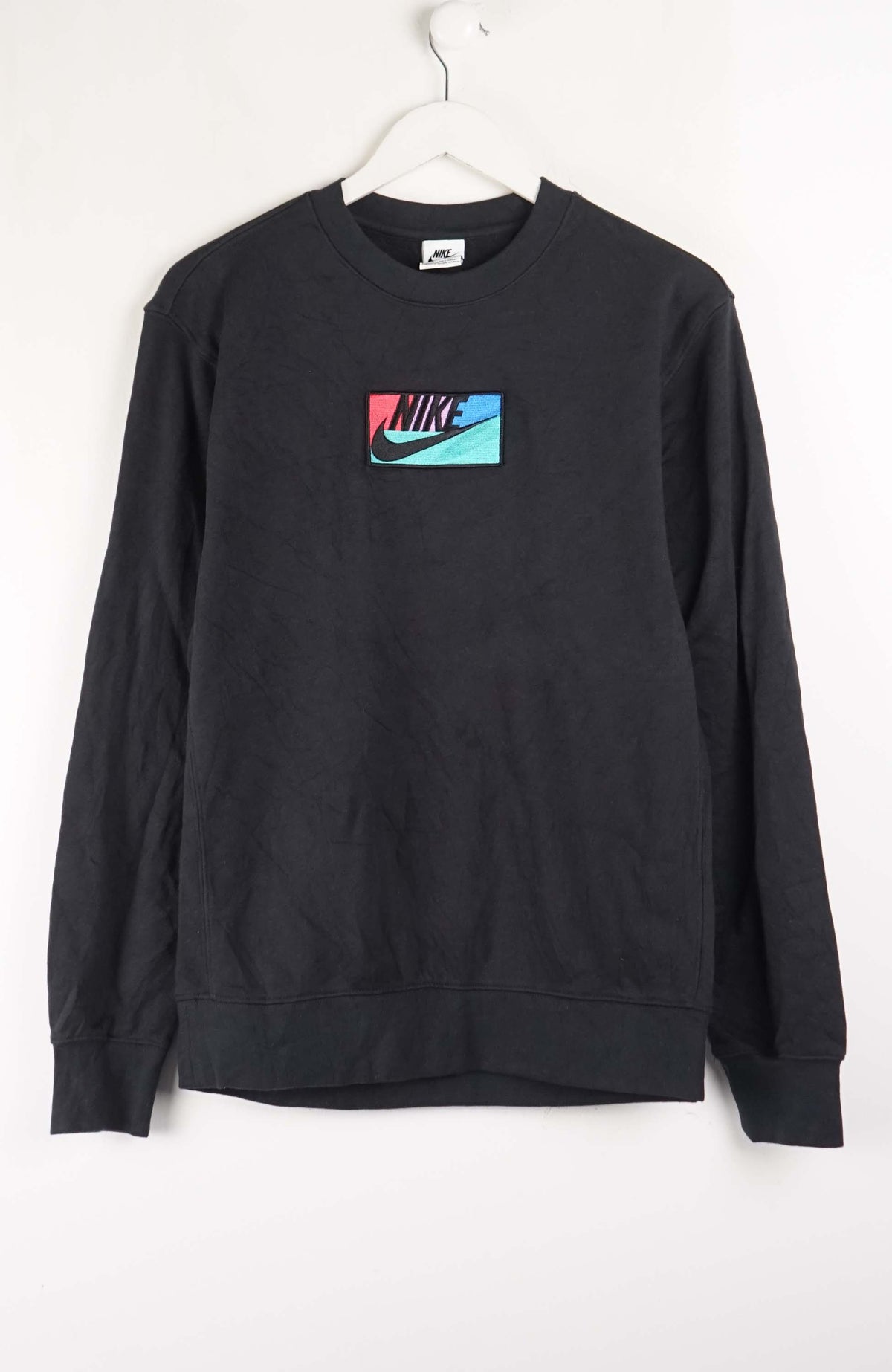 Black sweatshirt with Nike logo on a white background