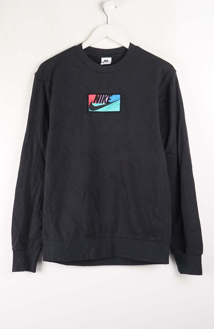 Black sweatshirt with Nike logo on a white background