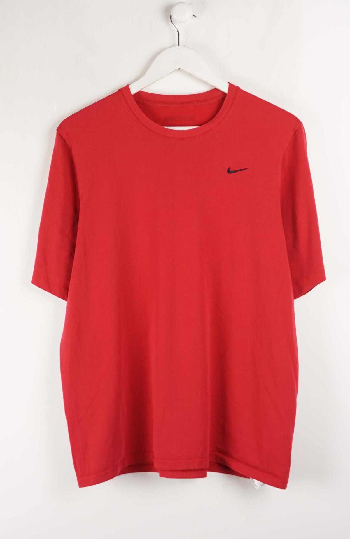 Red t-shirt with a black logo on a white hanger against a white background