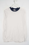 White long-sleeve shirt with navy collar on a white hanger against a white background