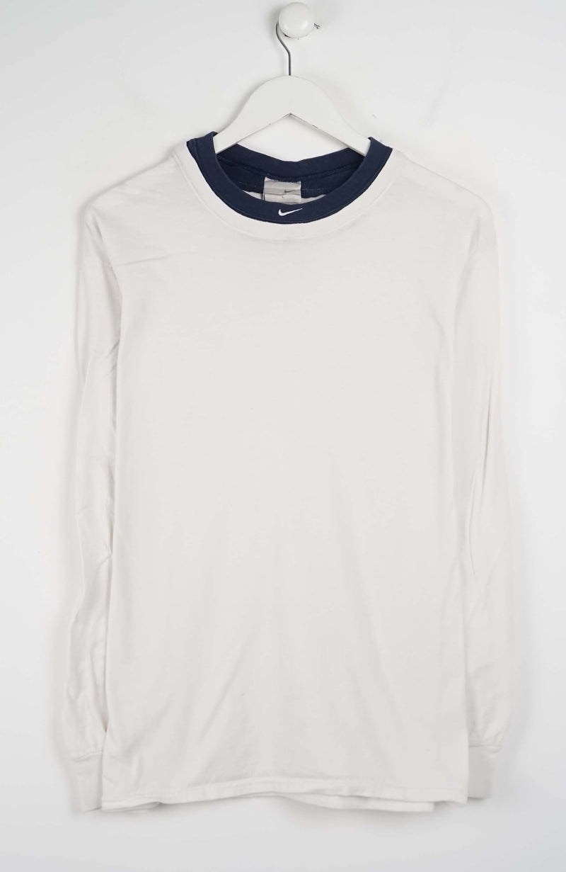 White long-sleeve shirt with navy collar on a white hanger against a white background