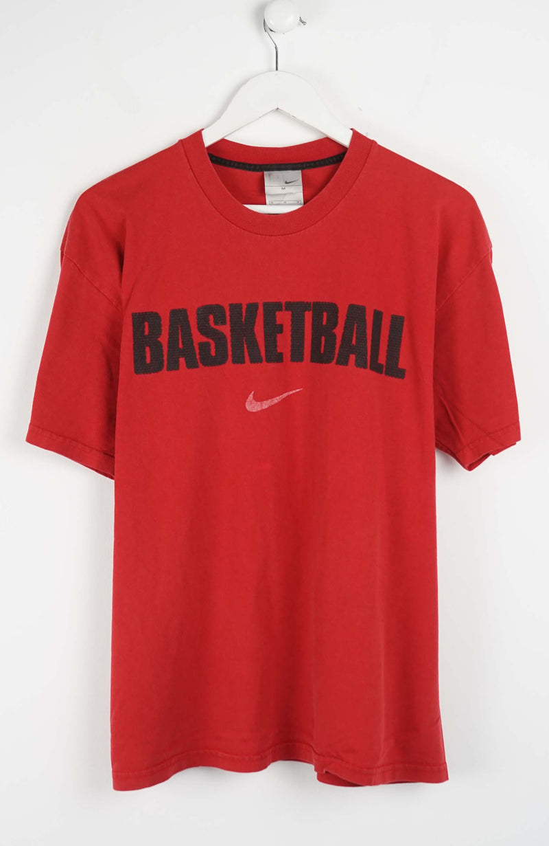 Red t-shirt with 'Basketball' text and Nike logo on a white background