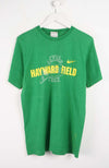 Green t-shirt with 'Hayward Field' text on a white background