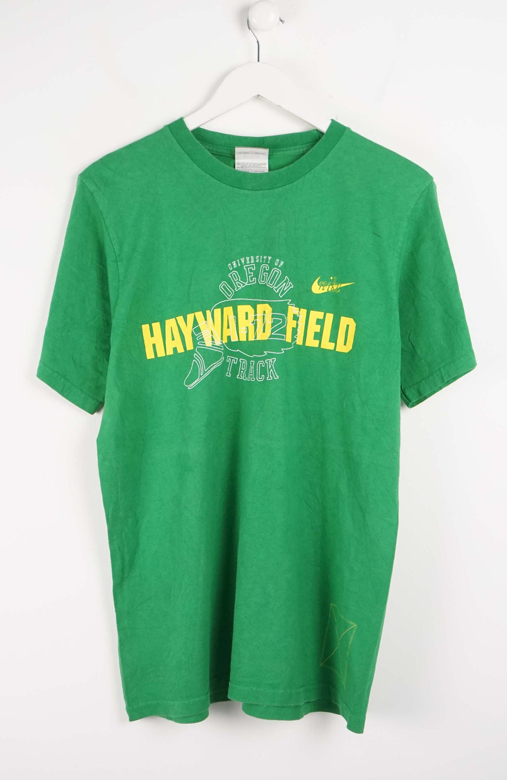 Green t-shirt with 'Hayward Field' text on a white background