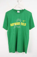 Green t-shirt with 'Hayward Field' text on a white background