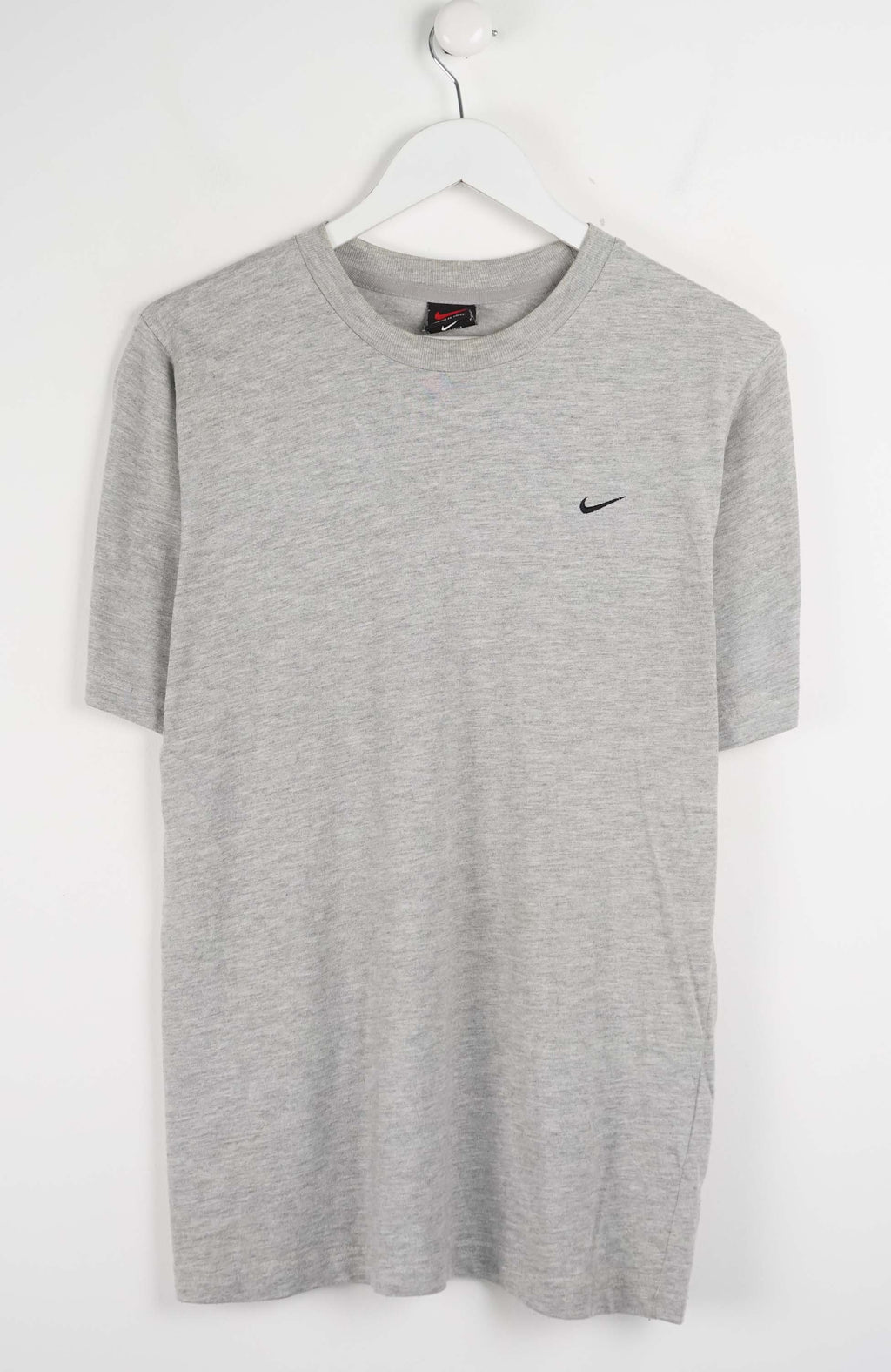 Gray t-shirt with a Nike logo on a white background