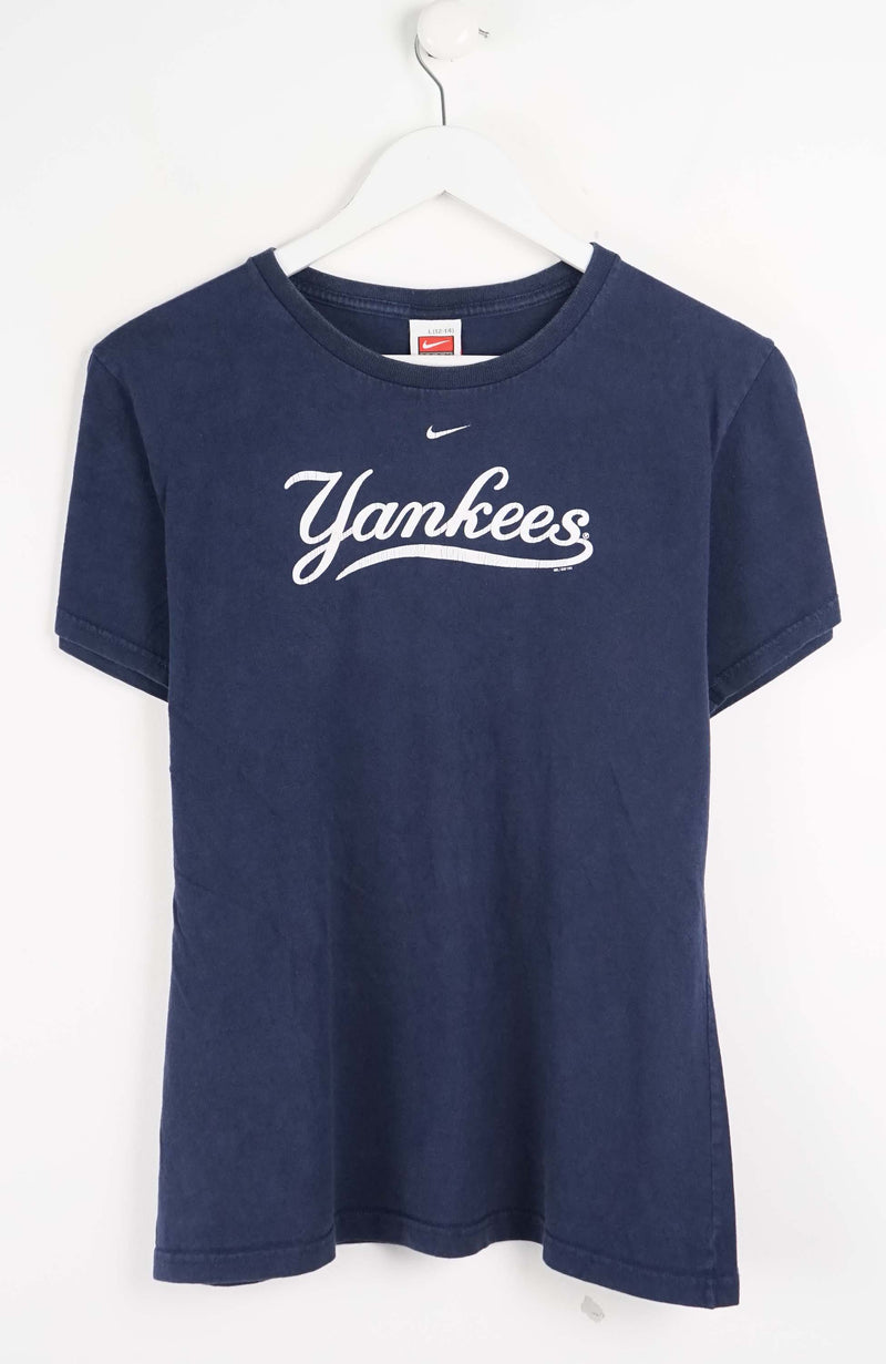 Navy blue t-shirt with 'Yankees' text on a white background