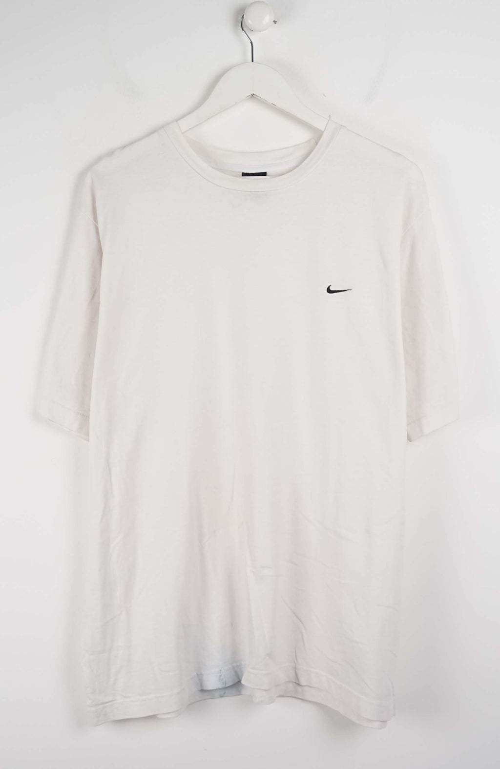White t-shirt with a black logo on a hanger against a white background
