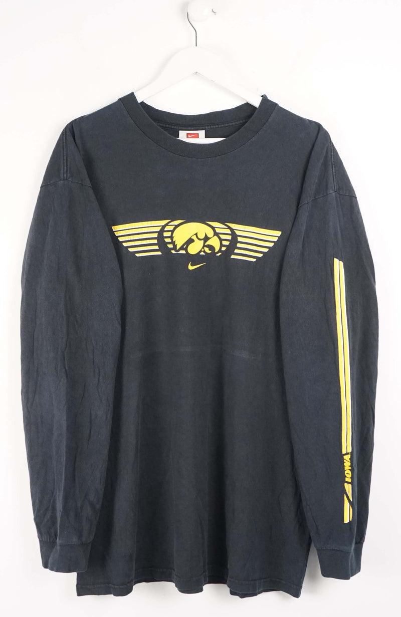 Black long-sleeve shirt with yellow graphics on a white background