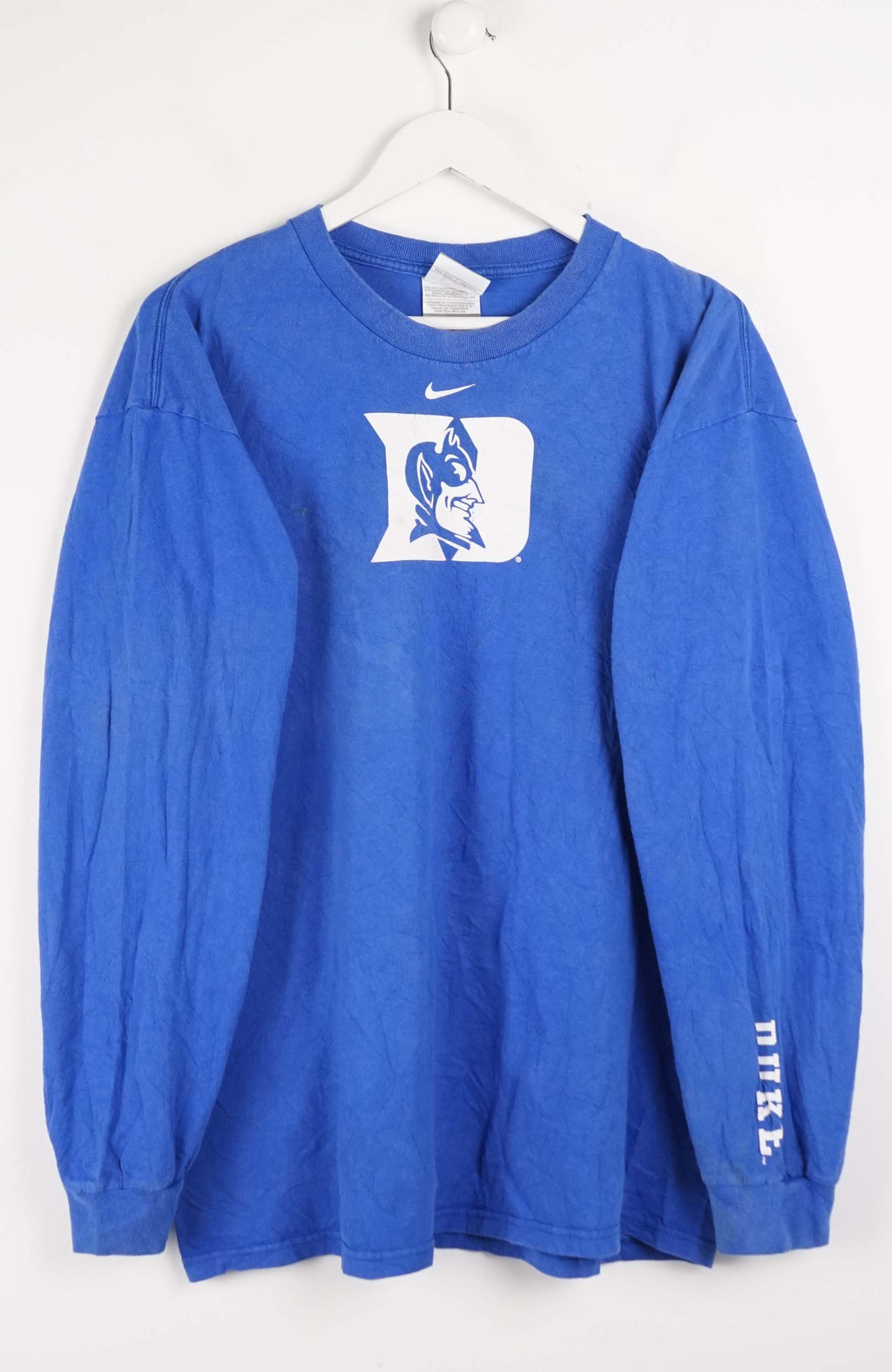 Blue long-sleeve shirt with a logo on a white background