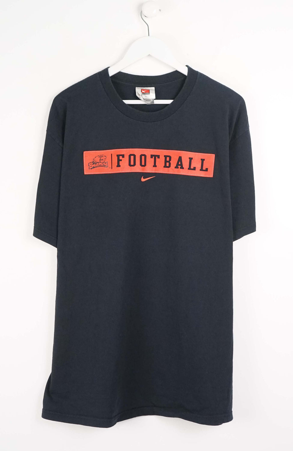Black t-shirt with red 'FOOTBALL' text and Nike logo on a white background