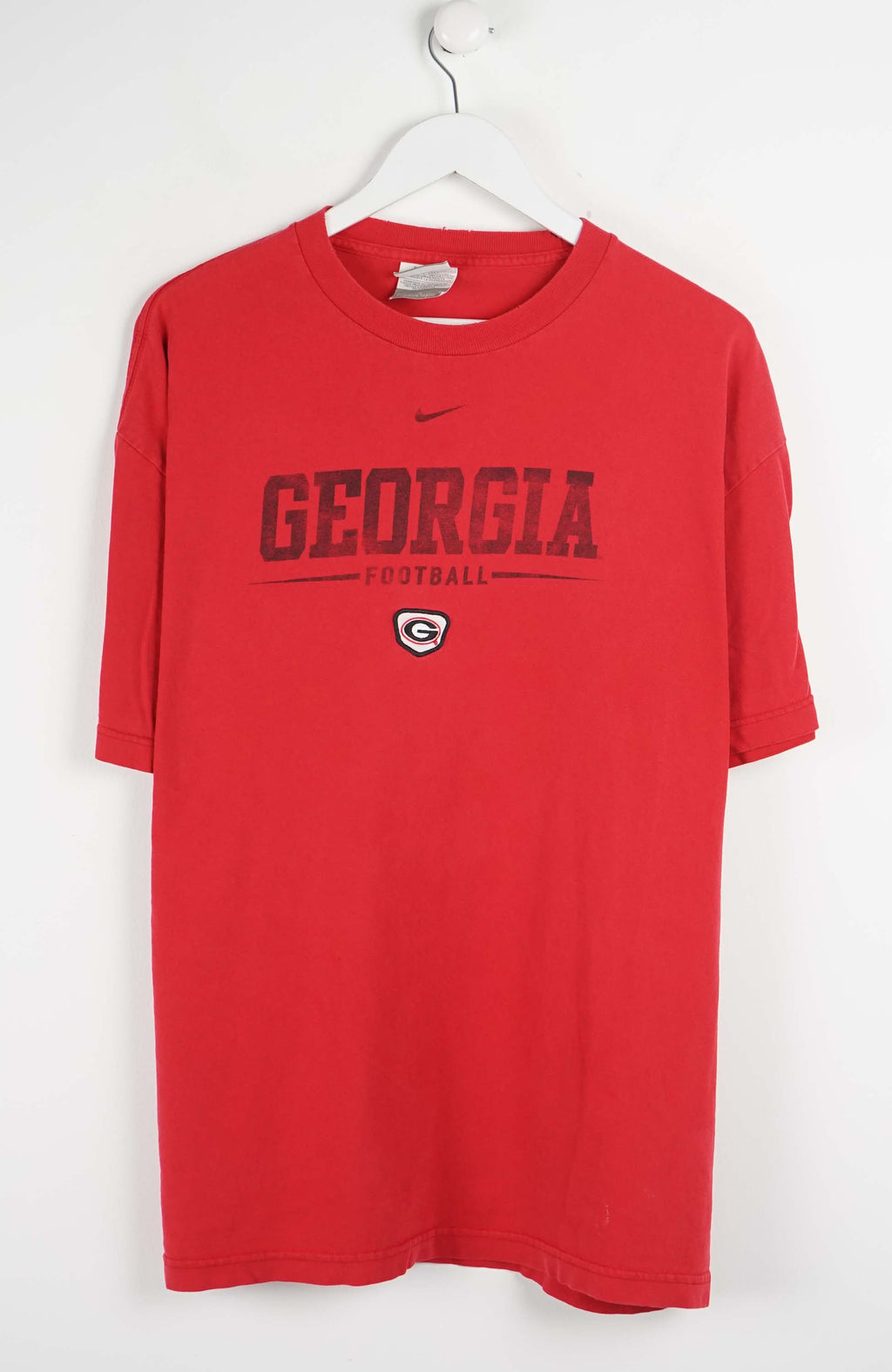 Red t-shirt with 'Georgia Football' text and Nike logo on a white background