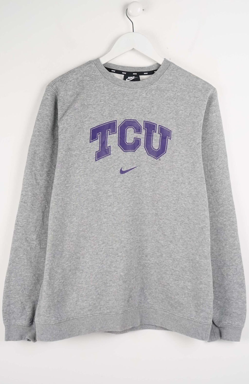 Gray sweatshirt with 'TCU' text on a white background