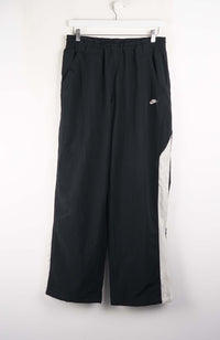 Black wide-leg pants with white side stripe on a white background