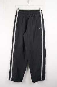 Black pants with white stripes on a white background