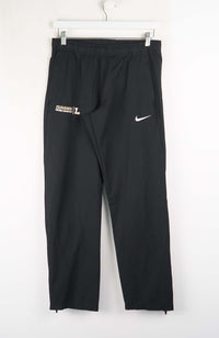 Black athletic pants with visible branding on a white background