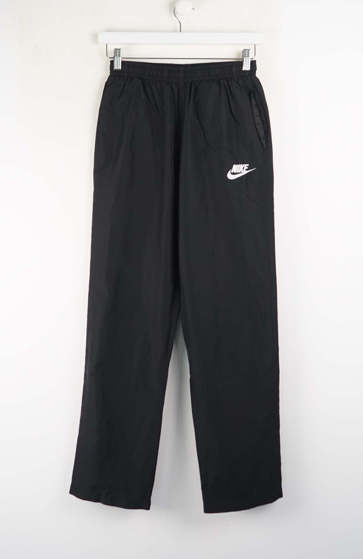 Black pants with a white logo on a white background