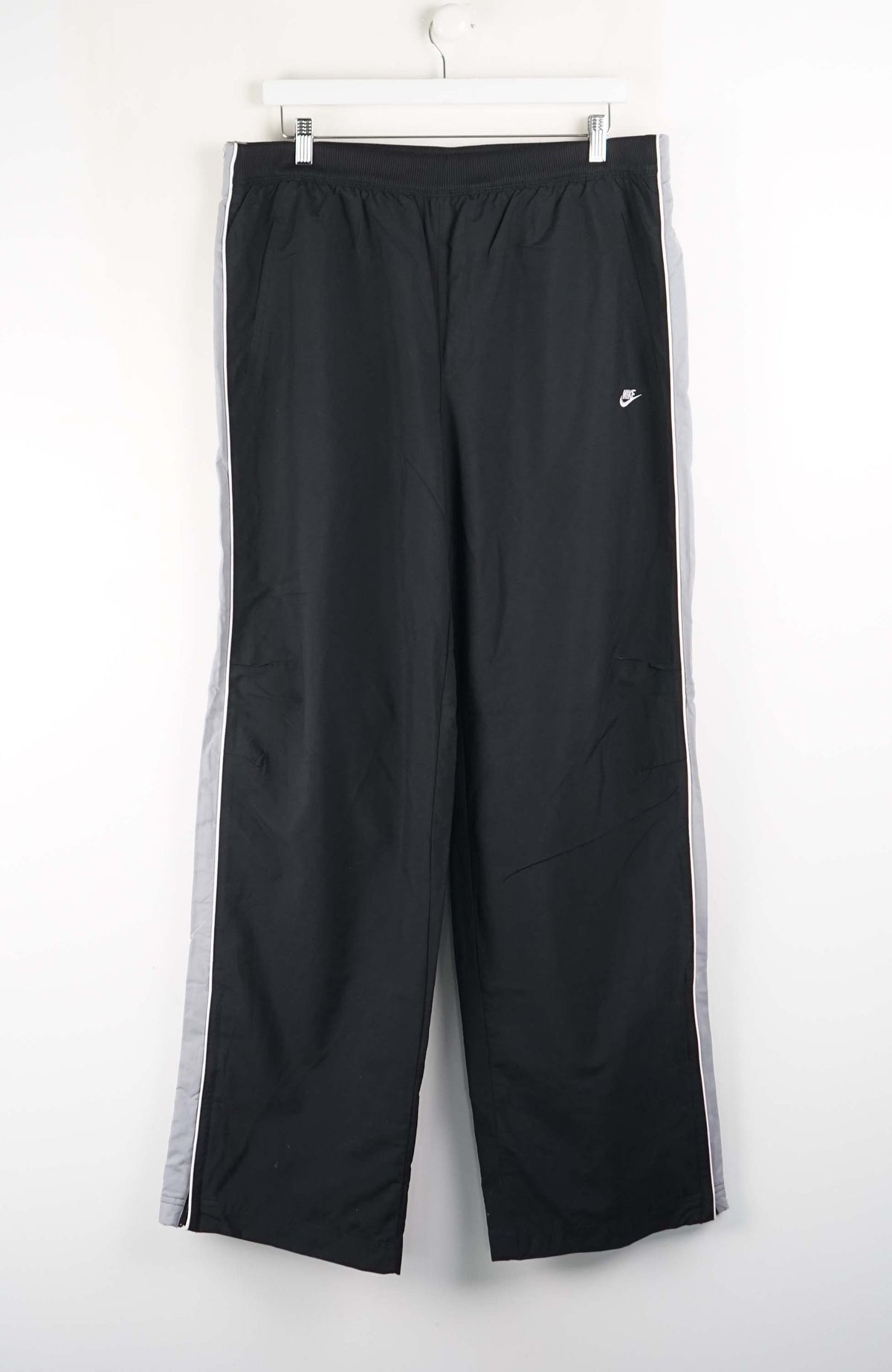 Black pants with a white logo on a white background
