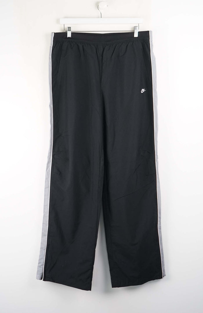 Black pants with a white logo on a white background