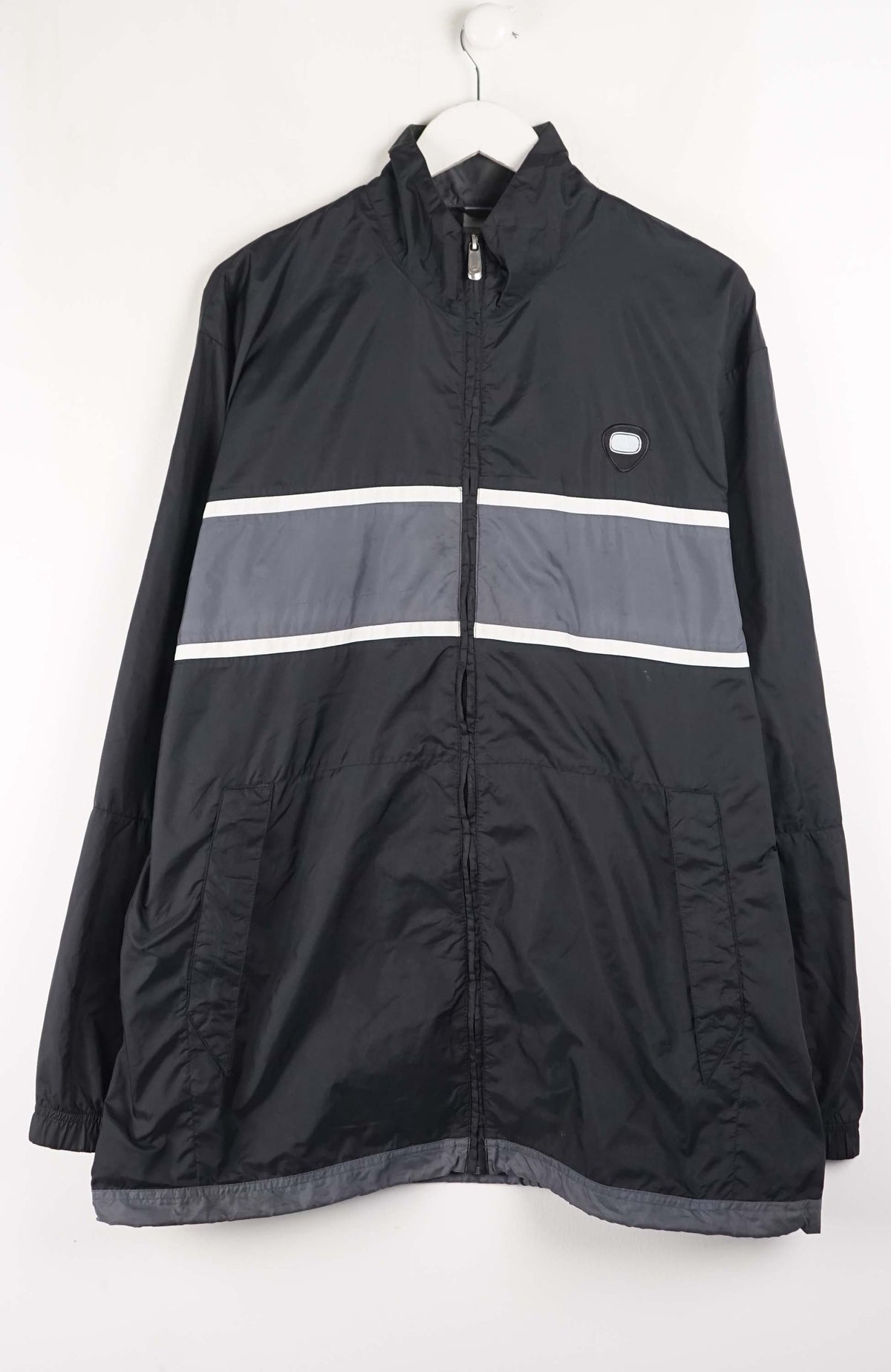 Black jacket with reflective stripes on a white background