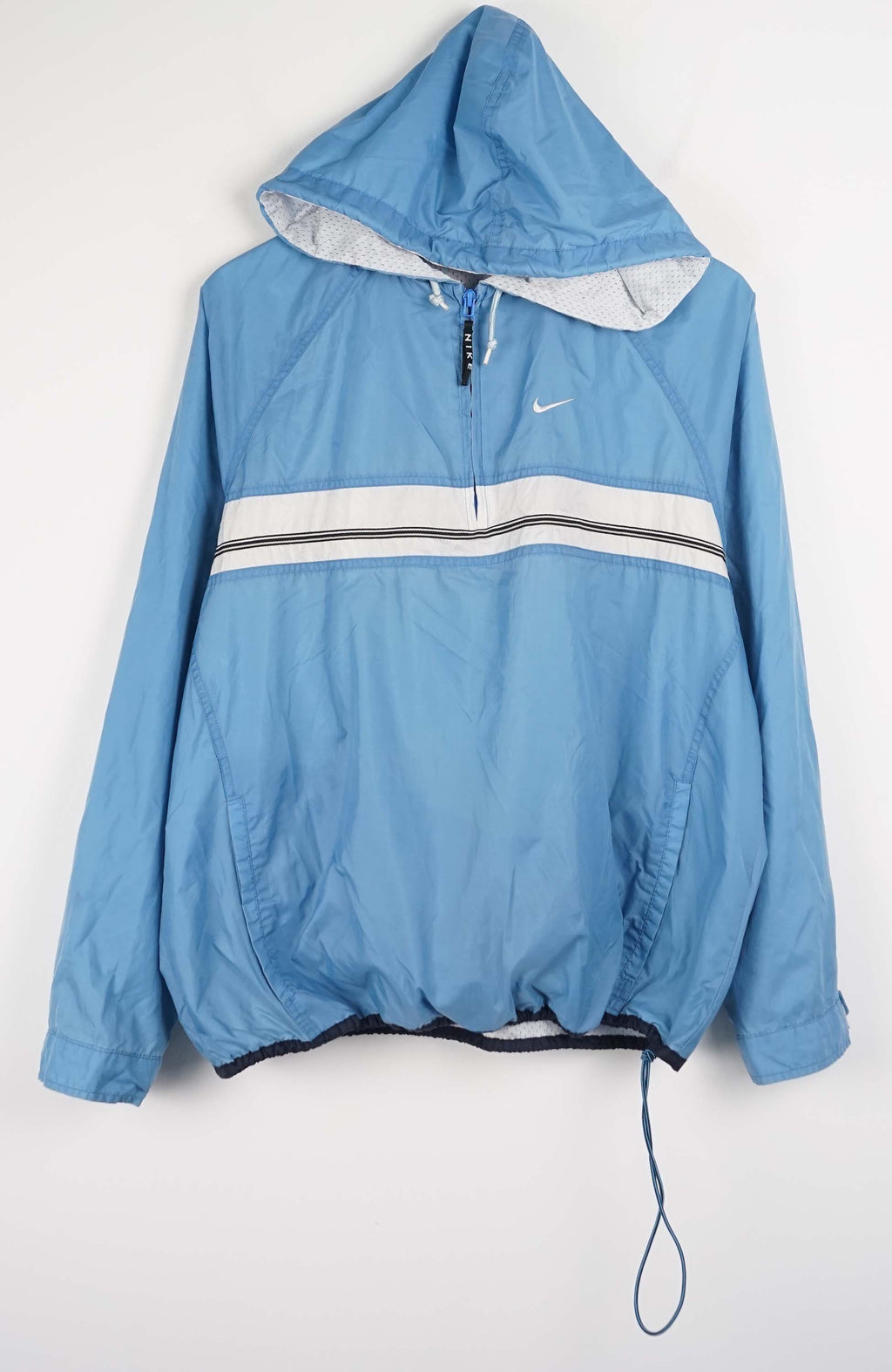 Blue hooded jacket with a Nike logo on a white background