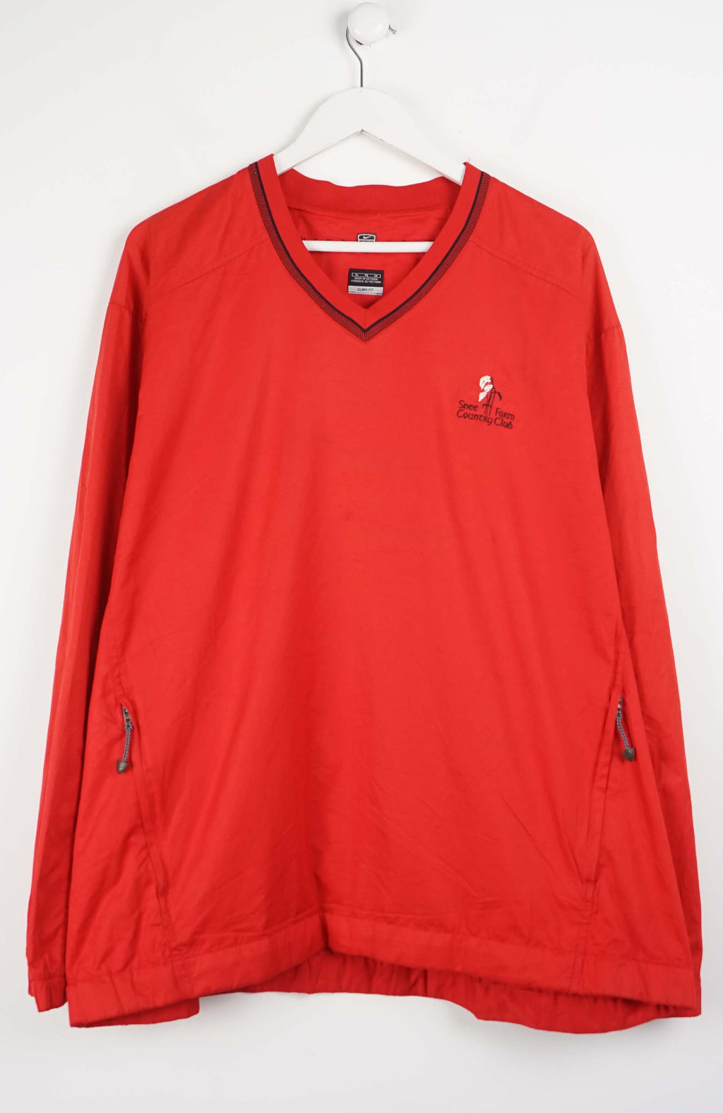 Red long-sleeve shirt with a logo on a white background