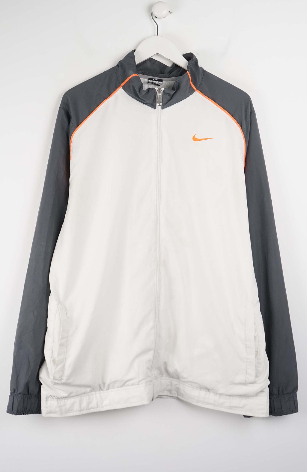 Gray and white jacket with Nike logo on a white background