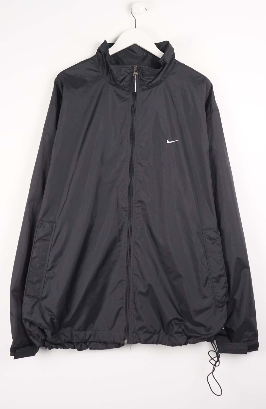 Black jacket with a Nike logo on a white background