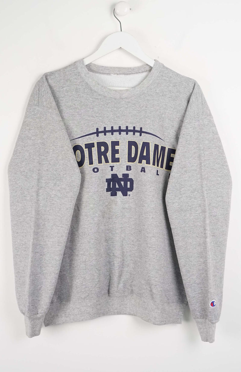 Gray sweatshirt with 'Notre Dame Football' text on a white background